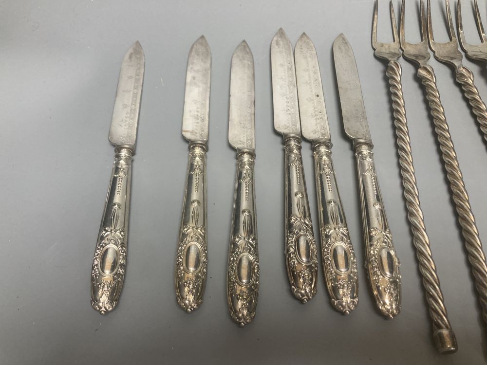 Twelve plated toasting forks and a set of six Victorian Elkington Mason & Co plated dessert knives and forks